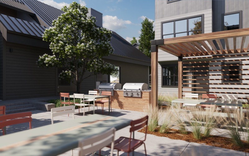 a patio and a tree with a table and chairs