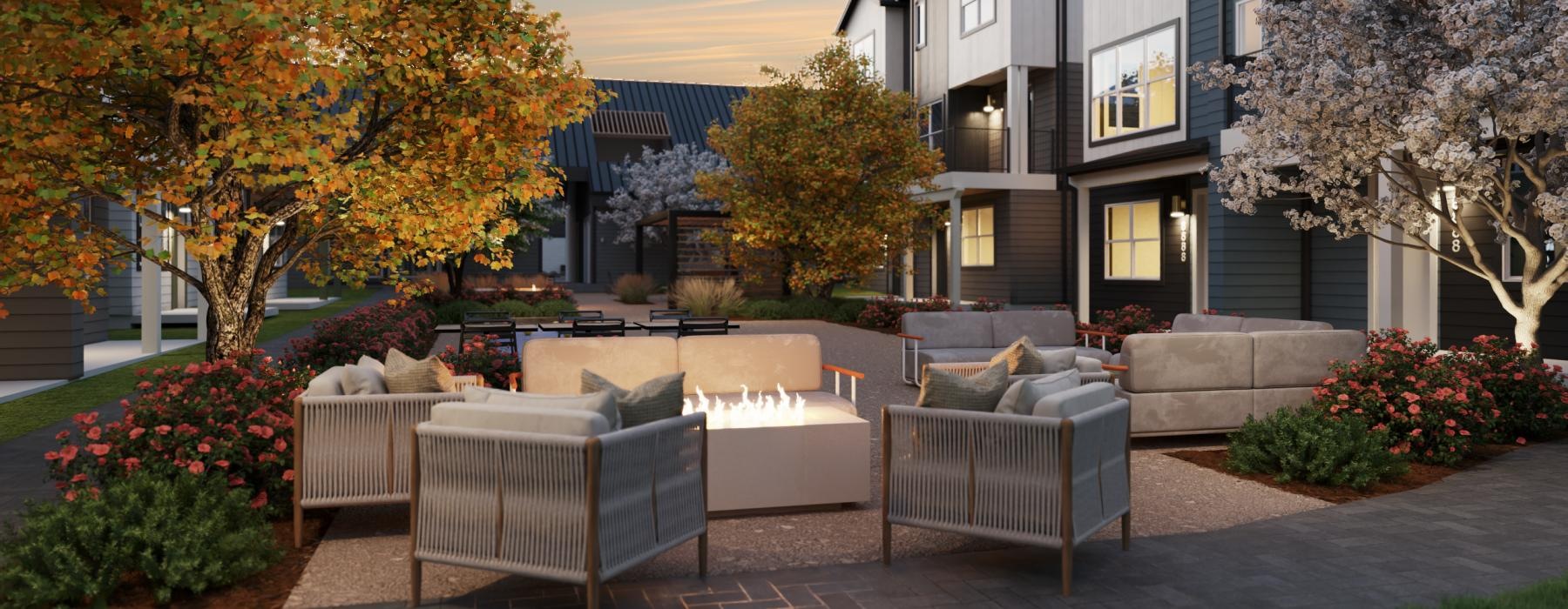 a courtyard with plants and fireplace